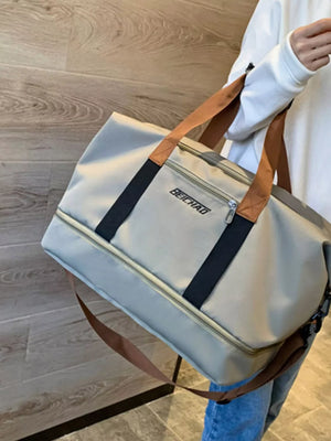 Premium Oxford cloth travel bag in light grey with dual handles and a crossbody strap.