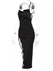 Black spaghetti strap midi dress with cowl neck and lace trim detail.