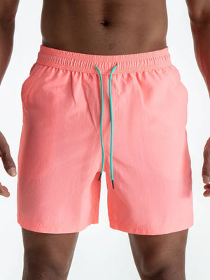 Burnt Coral swim shorts with contrast teal drawcord and elastic waistband.