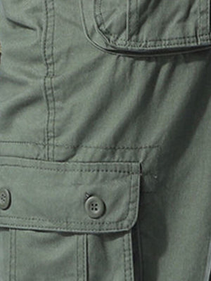 Men's army green cargo pants with button flap pockets and stretch fabric detail.