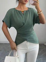 Green short sleeve maternity blouse with beaded keyhole neckline and wrap detail