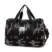 Textured black Oxford duffel bag with colorful wave pattern and dual zip bottom compartment.