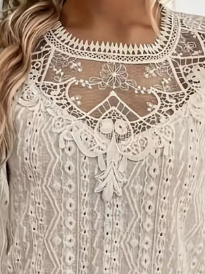 White eyelet embroidered blouse with intricate lace yoke detail