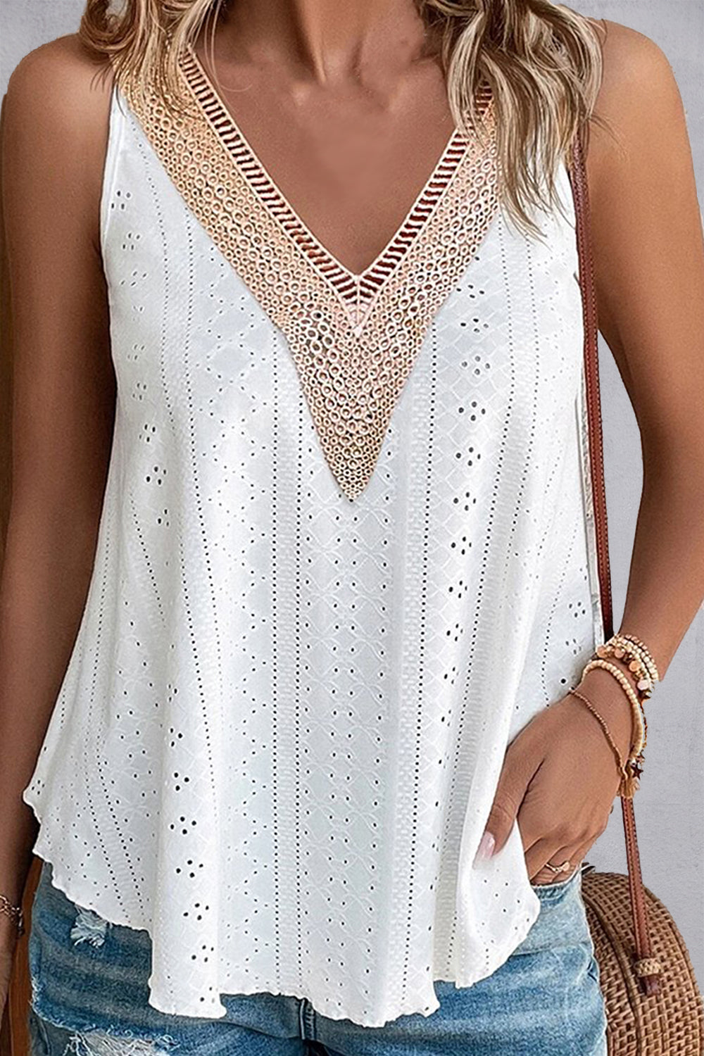 White eyelet inset V-neck tank top with crochet trim and a casual, chic style.