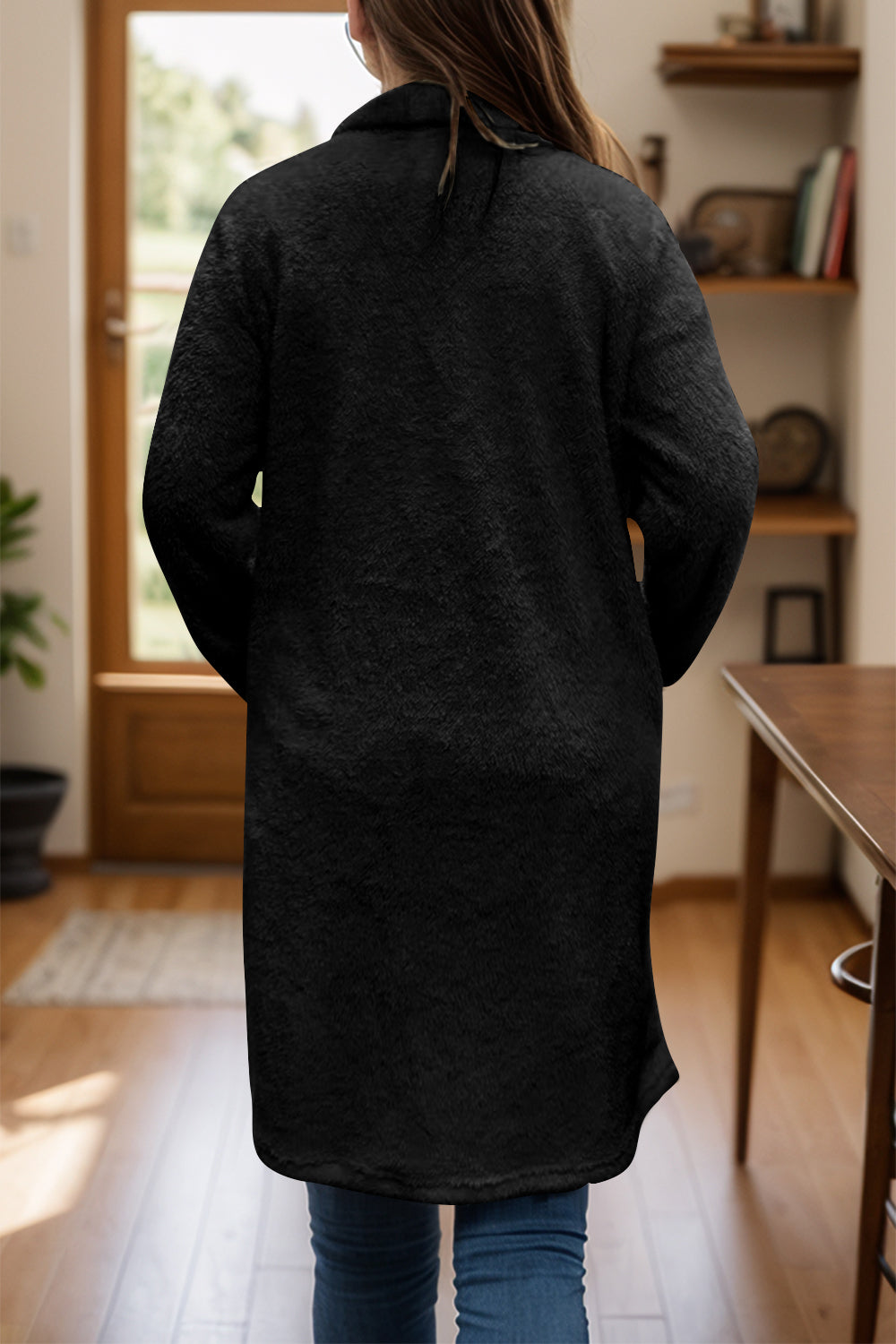 Black teddy bear texture duster coat with single button closure, long sleeves, and relaxed fit.