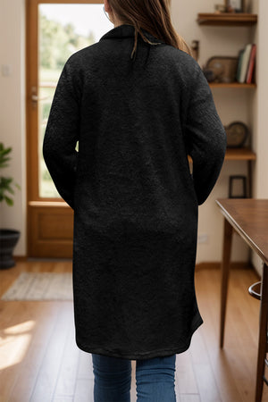 Black teddy bear texture duster coat with single button closure, long sleeves, and relaxed fit.