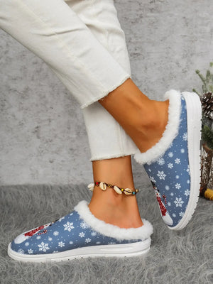Blue snowman print sherpa lined holiday slides with white snowflakes.