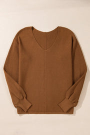Brown ribbed knit pullover sweater with balloon sleeves and V-neck.