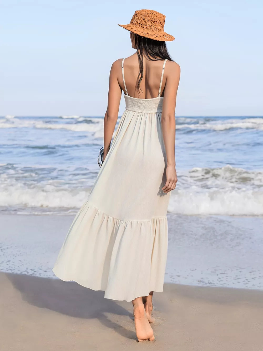 Cream ruched sweetheart neck maxi swim dress with tiered hem.