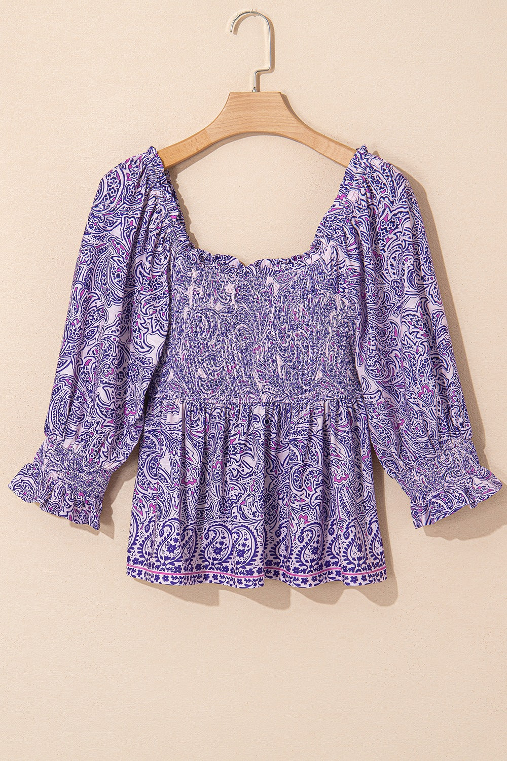 Paisley smocked bodice blouse in lavender with square neckline and ruffled cuffs.
