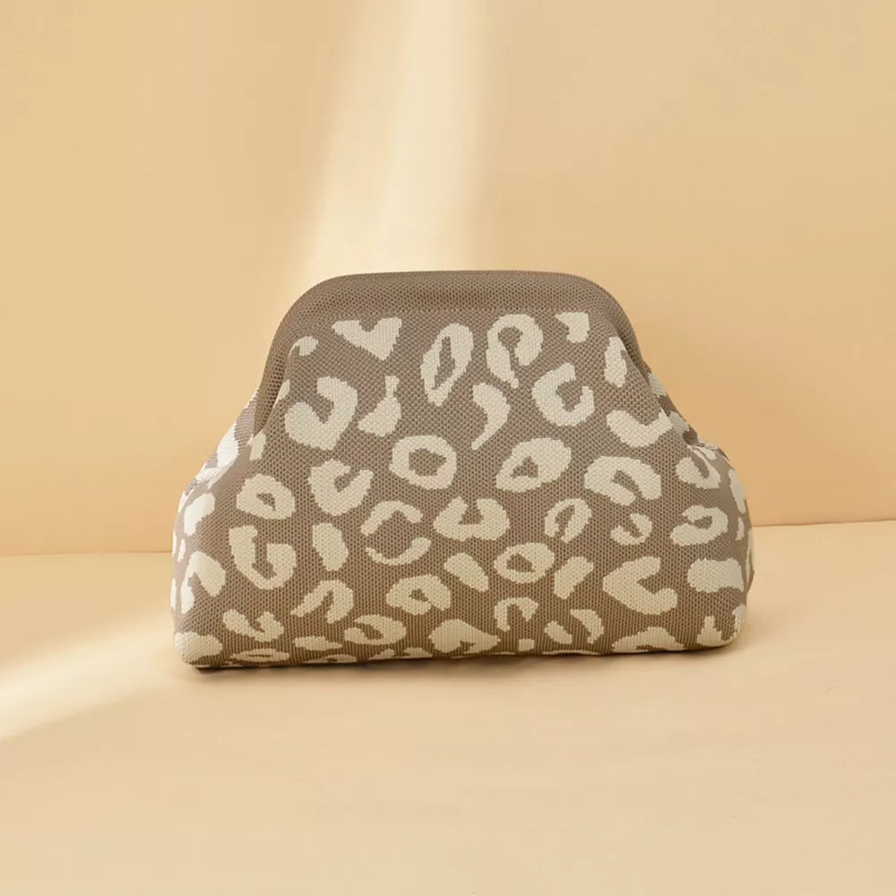 Knit clutch bag with a taupe and cream leopard print pattern.
