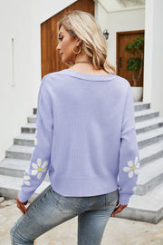 Lavender knit cardigan with daisy print on sleeves, crew neck, acrylic material.