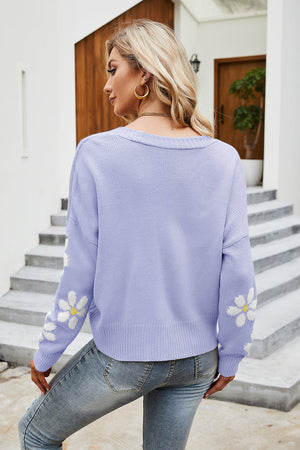 Lavender knit cardigan with daisy print on sleeves, crew neck, acrylic material.