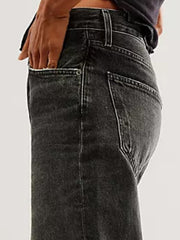 Black cuffed wide-leg denim trousers with a relaxed fit and visible pocket details.