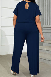 Dark Navy relaxed fit jumpsuit with short sleeves and keyhole back detail.