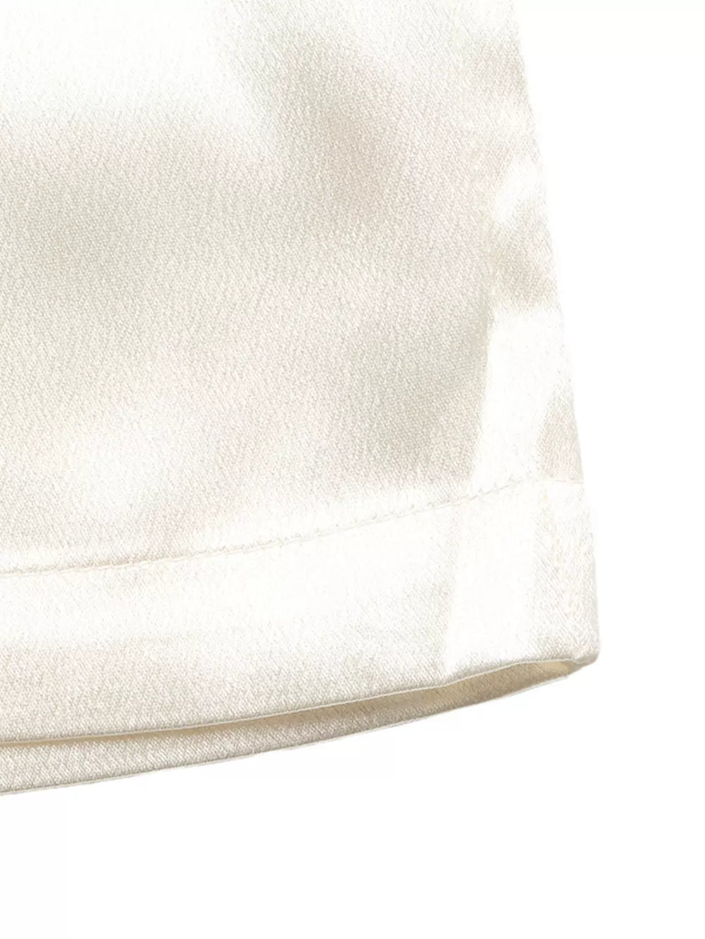 Beige maternity wide-leg trousers with a subtle texture and clean hem detail.