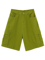 Matcha green baggy cargo bermuda shorts with button closure and flap pockets.