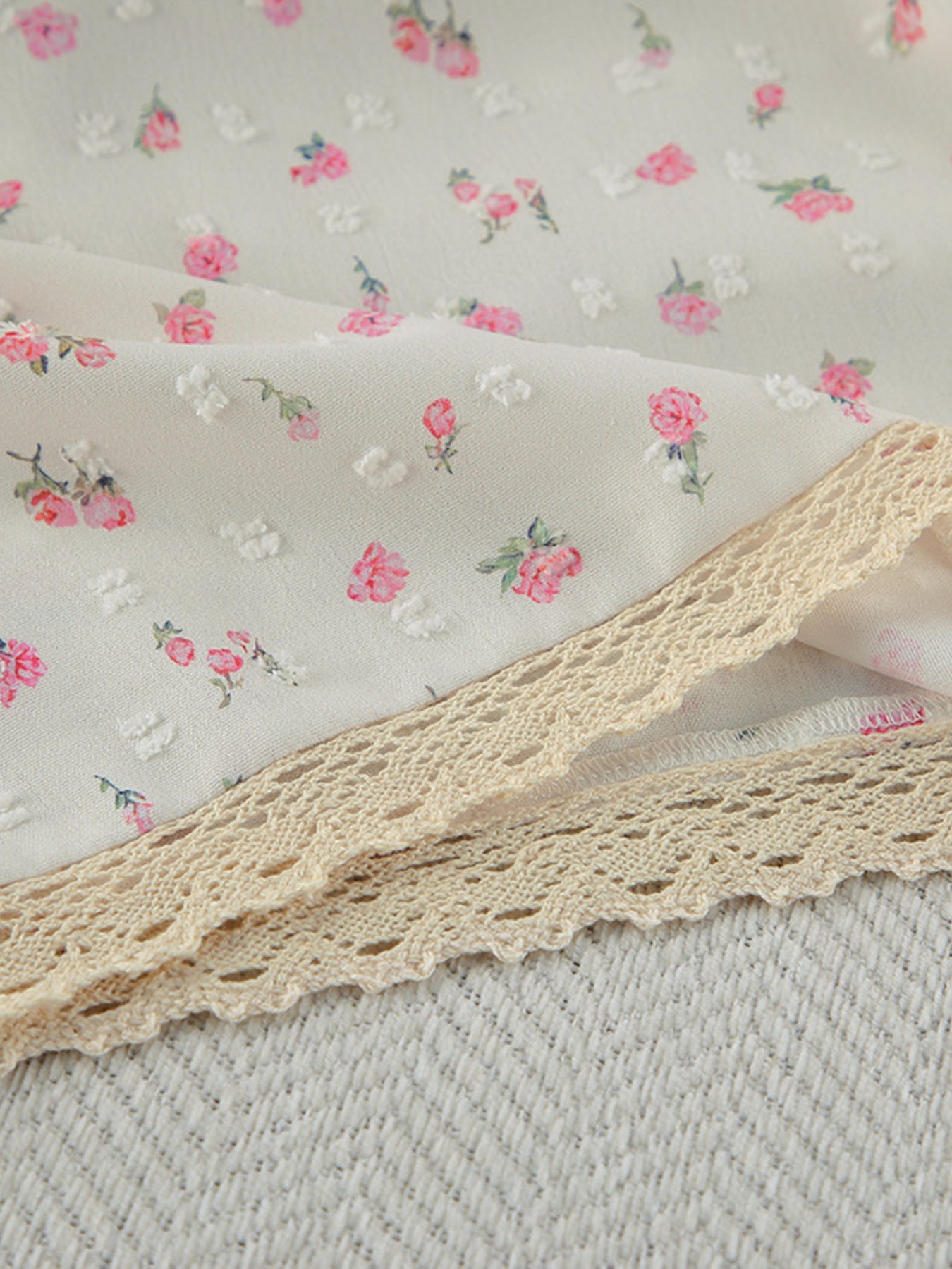 Cami and shorts set with delicate floral print and lace trim.