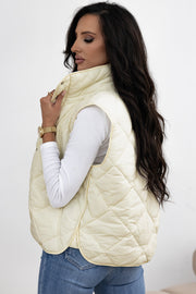 Ivory quilted stand collar vest with diamond stitching and a relaxed fit.
