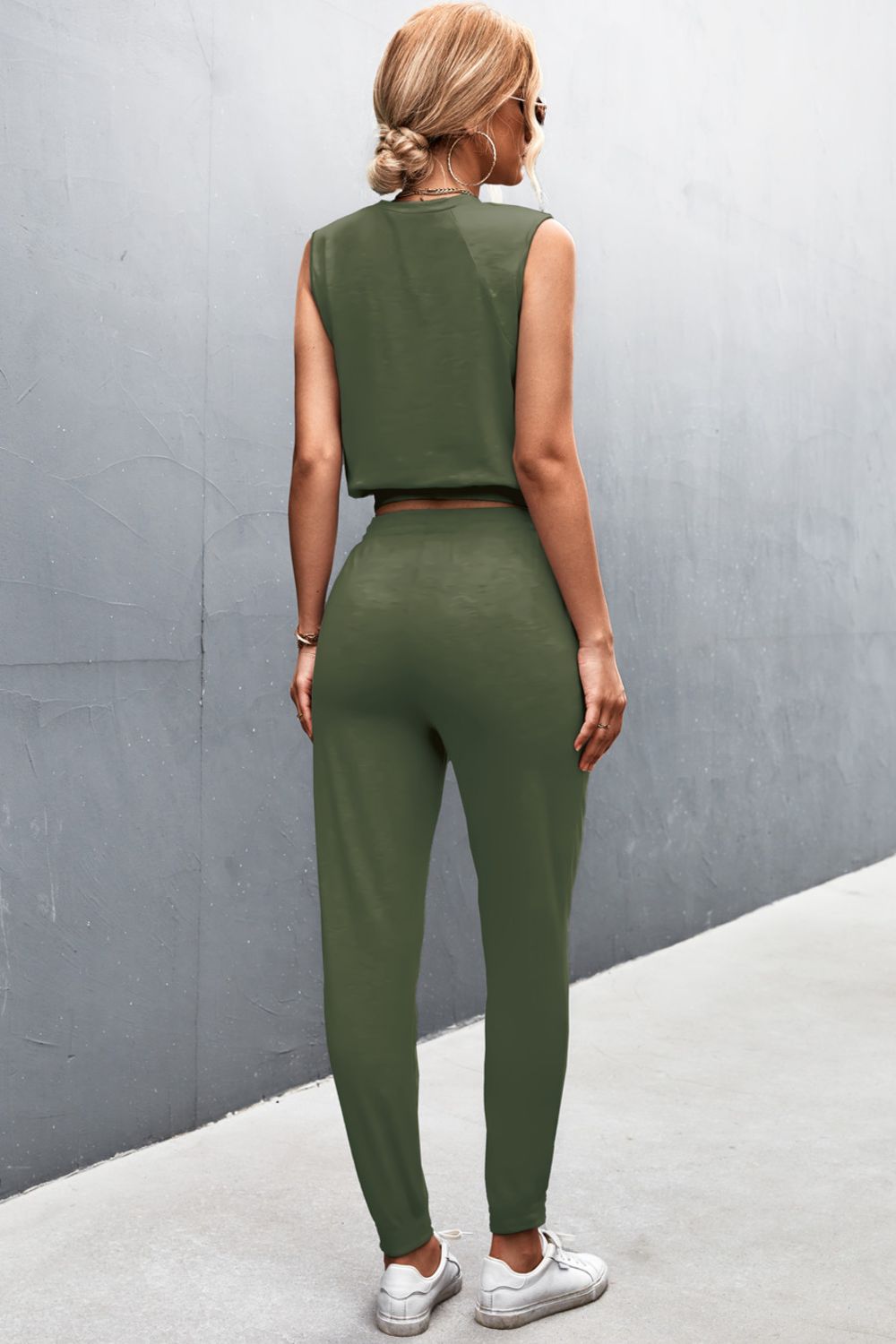Army green cropped muscle tank and jogger set with a relaxed fit.