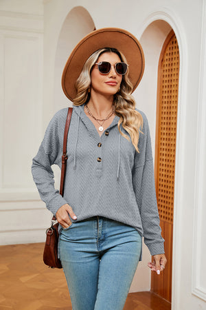 Textured grey henley hoodie with drop shoulder and drawstring hood