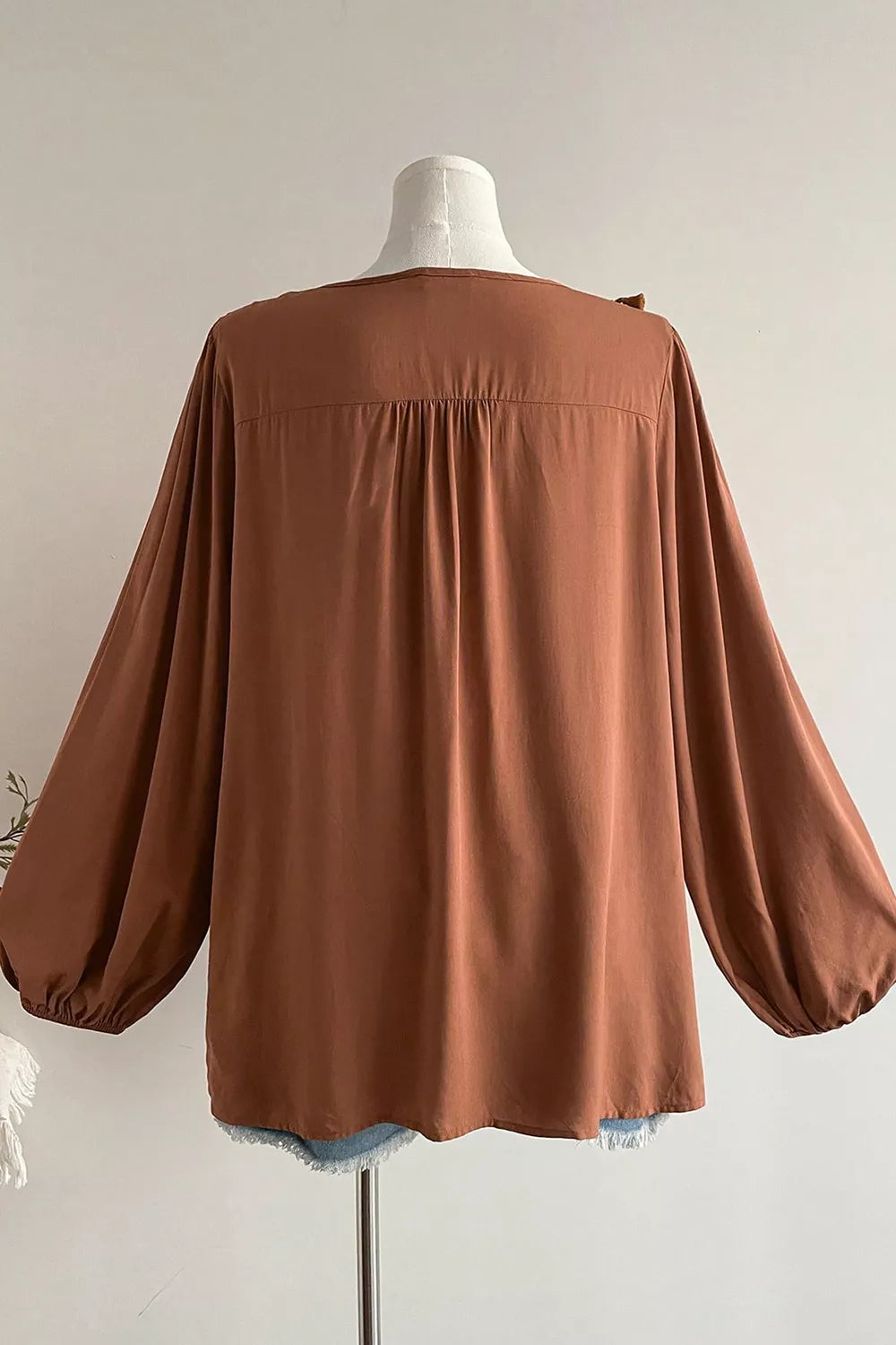 Plus Size V Neck Embroidered Tassel Blouse in Caramel, model styling view