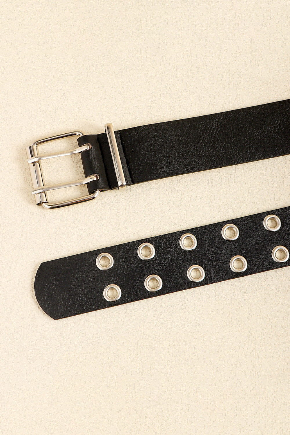 Black double buckle belt with silver eyelets and hardware