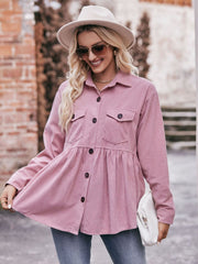 Pink corduroy peplum shirt jacket with button front and chest pockets.