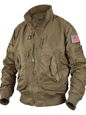 Men's taupe bomber jacket with multiple zippered pockets, patches, and ribbed cuffs.