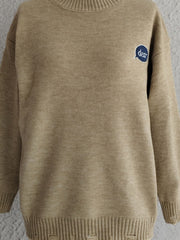 Tan relaxed knit sweater with embroidered "dear" speech bubble detail.