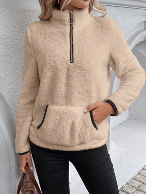 Khaki fleece quarter zip pullover with contrast trim on collar, cuffs, and pocket.