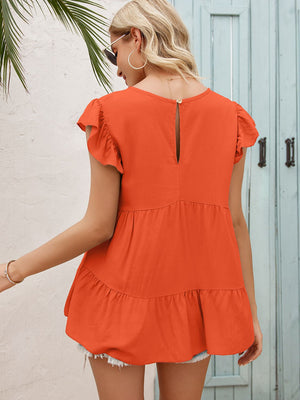 Orange babydoll blouse with ruffled sleeves and tiered hem, featuring a keyhole back detail.