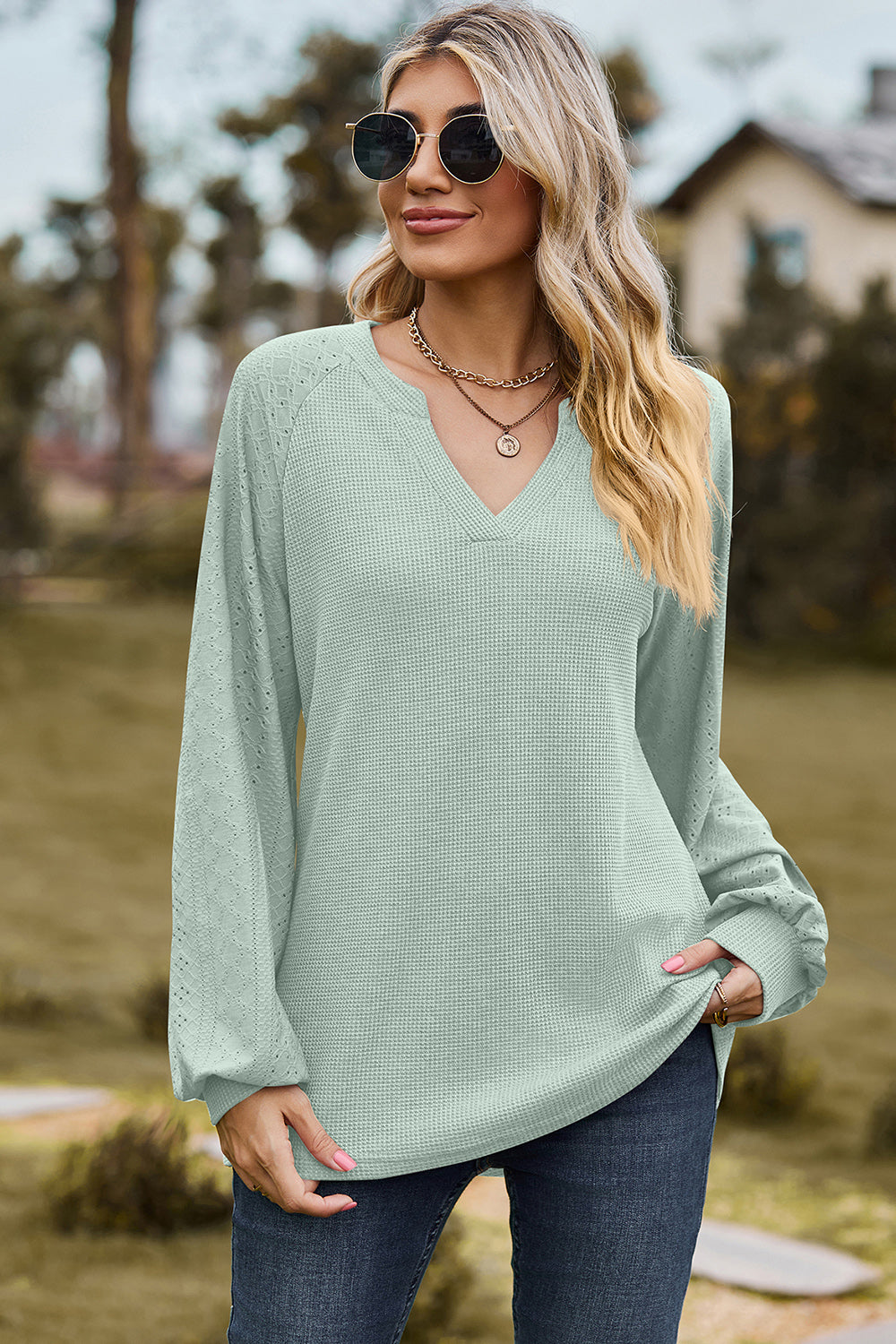 Light green waffle knit raglan V-neck top with eyelet detail on sleeves