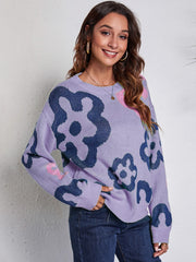 Lavender acrylic knit crewneck sweater with a bold navy floral print and casual fit.