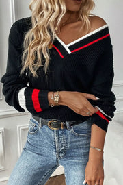 Black V-neck sweater with red and white striped trim on neckline and cuffs.