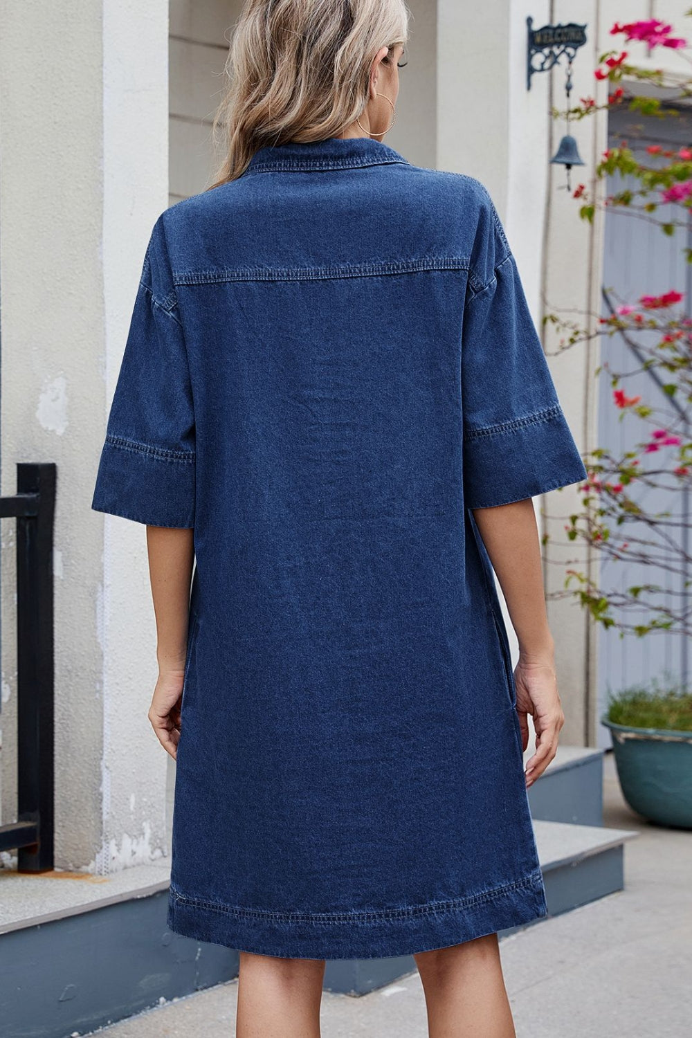 Collared denim mini dress in dark wash with short sleeves and pockets.