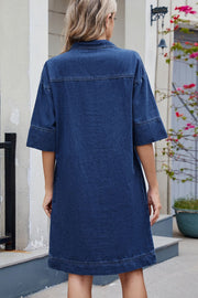 Collared denim mini dress in dark wash with short sleeves and pockets.