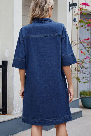Collared denim mini dress in dark wash with short sleeves and pockets.