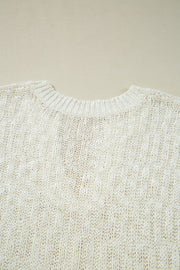 Textured knit V-neck shell top in beige acrylic with a subtle vertical rib pattern.