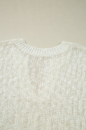 Textured knit V-neck shell top in beige acrylic with a subtle vertical rib pattern.