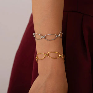 Elongated oval link bracelets in gold and silver, 18K gold-plated.
