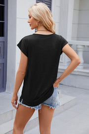 Black relaxed cap sleeve t-shirt with side slits and a pocket detail, worn with denim shorts.