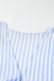 Light blue and white striped tie-front kimono jumpsuit with V-neckline.