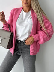 Hot Pink textured puff sleeve cardigan with open front and ribbed details.