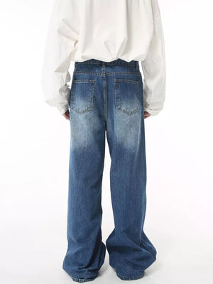 Timeless wide leg denim jeans in blue wash with faded details and a relaxed fit.
