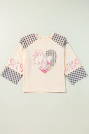 Patchwork heart raglan top in tan with plaid and floral details on sleeves and chest.