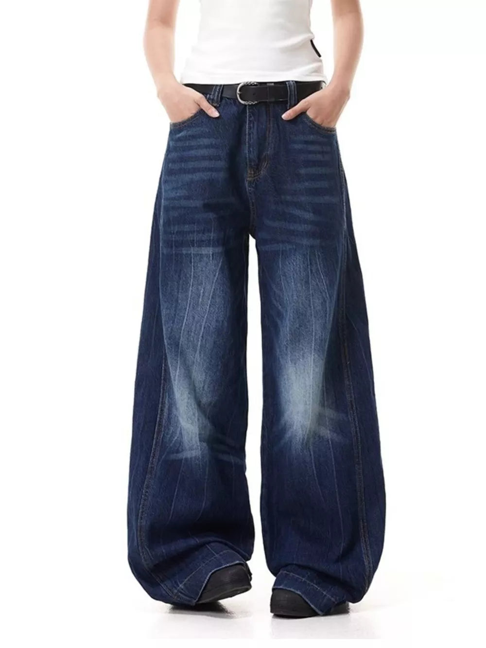Belted wide leg jeans in washed denim with vertical stripe detail.