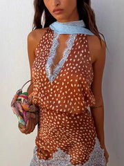 Brown polka dot halter top with lace trim and matching lace skirt.