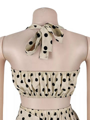 Cream polka dot cami with halter tie and elasticated hem, part of a set.