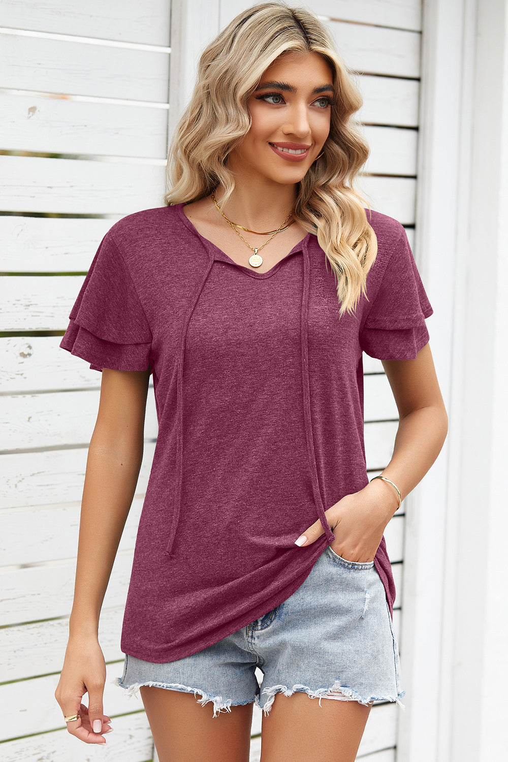 Burgundy flutter sleeve henley tee with tie neck detail and layered sleeves.